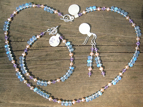 Dusty pink Fresh Water Pearls & soft lilac Swarovski Crystals with dainty droplets in blue tones. Necklace $45.00 Bracelet $28.00 Earrings $18.00
